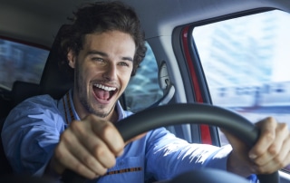 Excited Man driving a car